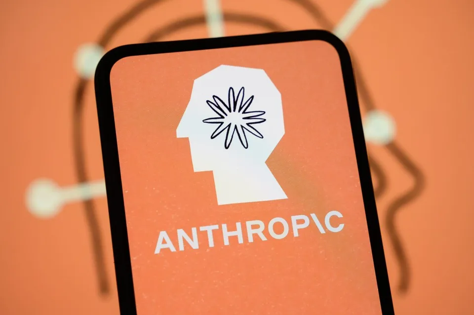 Anthropic logo displayed on a smartphone against an orange background.
