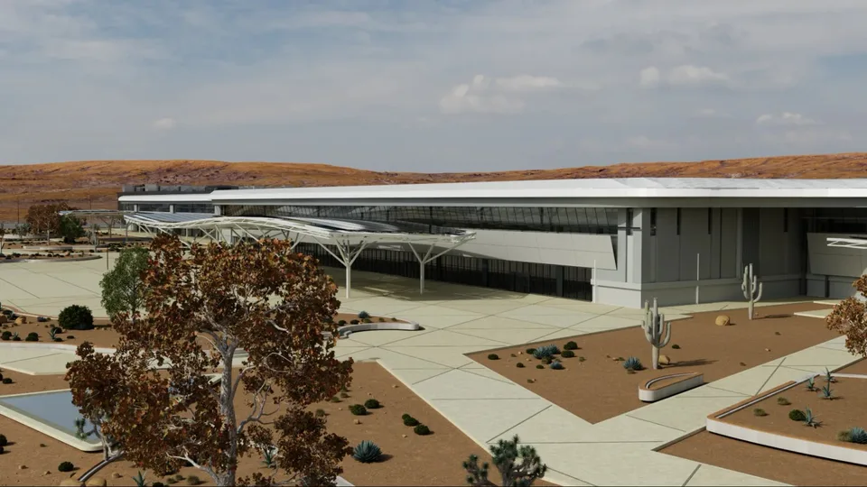 A rendered view of a large AI factory campus with surrounding landscaping and infrastructure.