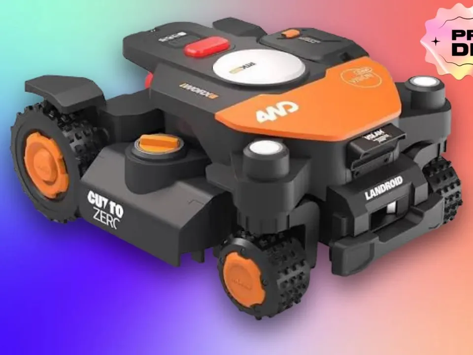 Worx WR341 robotic lawn mower with four orange wheels on a colorful gradient background.