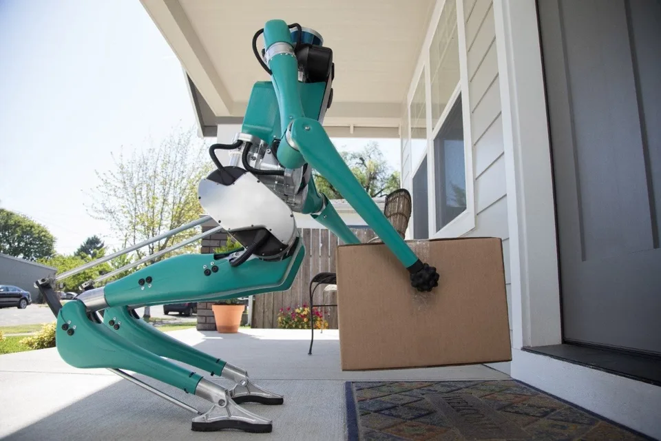 Agility Robotics humanoid robots handle boxes and organize parts in industrial workspaces.