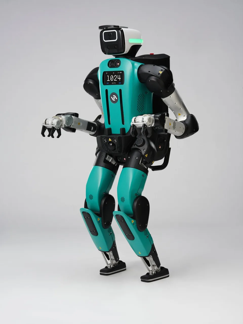 Agility’s turquoise-and-black Digit humanoid robot standing against a plain background.