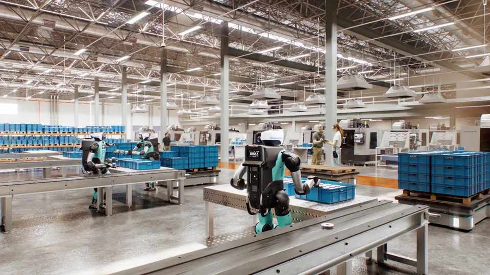 Humanoid robots working among conveyor belts and storage bins in a warehouse.